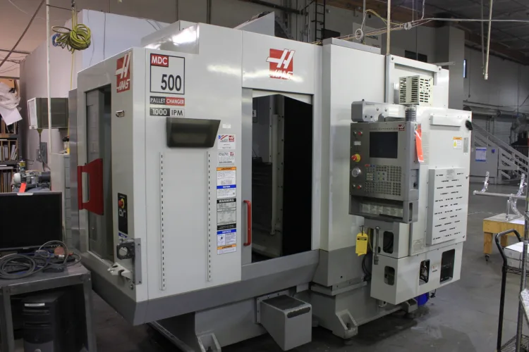 Photo #1 of SURPLUS TO HAECO AMERICAS - FEATURING: 2005 HAAS MDC-500 CNC VERTICAL MACHINING CENTER, GORGEOUS 75 TON BLISS VARI-SPEED OBI PUNCH PRESS, 60 TON ROUSELLE OBI PUNCH PRESS, SAMCO CLICKER PRESS,MILLING MACHINES, DRILL PRESSES, GRINDERS, (11) SEWING MACHINES,