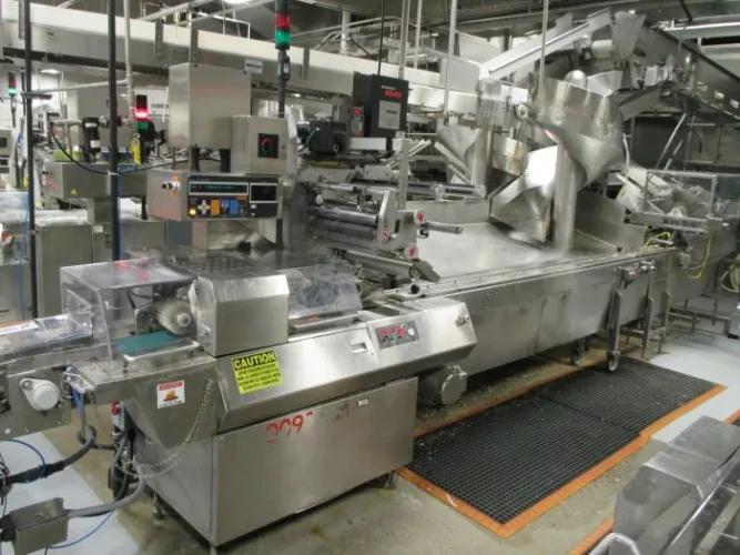 Photo #2 of BAKING & PACKAGING EQUIPMENT FORMERLY OF NESTLE: (2) CPM WOLVERINE 4-ZONE AIR IMPINGEMENT OVENS & (6) FUJI MODEL FW3700 HORIZONTAL FLOW WRAPPERS