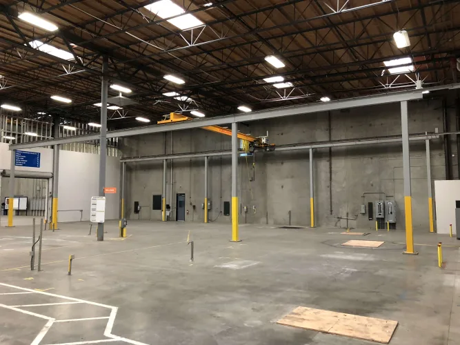 Photo #5 of EAGLEBURGMANN - ABRASIVE BLAST & SPRAY BOOTH W/ AWNING, DUST CONTAINMENT BOOTH, FREESTANDING BRIDGE CRANE SYSTEM, 1/2 TON & 2 TON JIB CRANES & LARGE QUANTITY OF HOSE REELS
